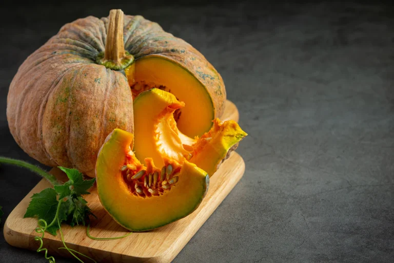 chopped-raw-pumpkin-put-wooden-cutting-board_1150-34560